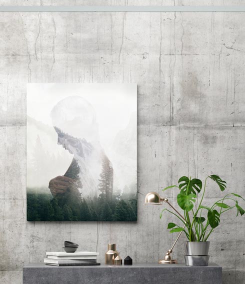 artiteq-click-rail-pro-concrete-wall-hang-logic-490 picture of woman hung on concrete wall with picture hanging system