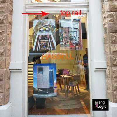 Pictures hanging from a window architrave