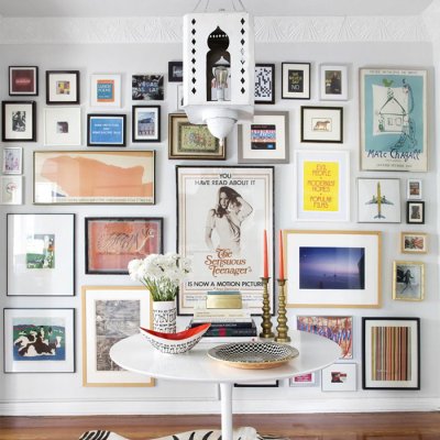 Many different pictures hung on the wall