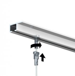 Top Rail with Twister Hanging Wire for Picture Hanging Illustration of a top rail with a Twister hanging wire being twisted into it for picture hanging.